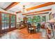 Bright dining room with wood floors, exposed beams, and natural light at 8504 Knollwood Cir, Charlotte, NC 28213
