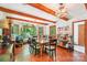 Bright dining room with wood floors, exposed beams, and natural light at 8504 Knollwood Cir, Charlotte, NC 28213