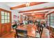 Bright dining room with wood floors, exposed beams, and natural light at 8504 Knollwood Cir, Charlotte, NC 28213