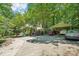 Exterior of home featuring a spacious yard, driveway, and covered parking at 8504 Knollwood Cir, Charlotte, NC 28213