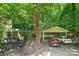 Charming home exterior with lush green landscaping and two car parking at 8504 Knollwood Cir, Charlotte, NC 28213