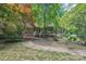 Charming home with a covered front porch and lush landscaping at 8504 Knollwood Cir, Charlotte, NC 28213
