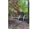 Charming home featuring a wide front porch and mature trees, creating a serene and inviting outdoor space at 8504 Knollwood Cir, Charlotte, NC 28213