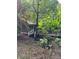 Charming home with front porch surrounded by lush foliage offering a serene, private approach at 8504 Knollwood Cir, Charlotte, NC 28213