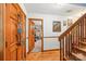 Charming hallway with wooden accents, natural light, and a glimpse into the adjacent room at 8504 Knollwood Cir, Charlotte, NC 28213
