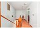Upstairs hallway featuring wood floors and doors and a neutral wall color at 8504 Knollwood Cir, Charlotte, NC 28213