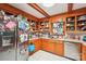 Cozy kitchen with wood cabinets, stainless steel appliances, and a bright window at 8504 Knollwood Cir, Charlotte, NC 28213
