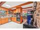 Kitchen features wood accents, stainless appliances, and an open design flowing to the dining area at 8504 Knollwood Cir, Charlotte, NC 28213