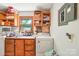 Functional laundry room with ample storage and a window for natural light at 8504 Knollwood Cir, Charlotte, NC 28213