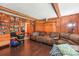 Inviting living room with hardwood floors, wood-paneled walls, and ample seating at 8504 Knollwood Cir, Charlotte, NC 28213