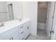 Bathroom with double vanity, white cabinets, and a shower/tub combo at 8692 Acadia Pkwy # 591, Sherrills Ford, NC 28673