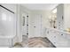 Bright bathroom with herringbone tile floors and a white vanity at 8692 Acadia Pkwy # 591, Sherrills Ford, NC 28673