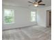 Bright bedroom with large windows and neutral carpeting, ceiling fan, closet at 8692 Acadia Pkwy # 591, Sherrills Ford, NC 28673