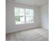 Bright bedroom with large window offering an exterior view at 8692 Acadia Pkwy # 591, Sherrills Ford, NC 28673