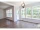 Open-concept dining area with natural light, wood floors, and seamless flow to other living spaces at 8692 Acadia Pkwy # 591, Sherrills Ford, NC 28673