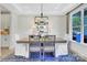 Elegant dining room with stylish chandelier, large window and seating for six at 8692 Acadia Pkwy # 591, Sherrills Ford, NC 28673
