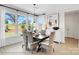 A well-lit dining room with large windows, a dark wood table, and decorative accents at 8692 Acadia Pkwy # 591, Sherrills Ford, NC 28673