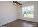 Dining room with hardwood floors, board and batten trim, modern lighting, and a view to outdoors at 8692 Acadia Pkwy # 591, Sherrills Ford, NC 28673