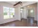 Dining room with hardwood floors, trim, and a view to the front yard through a window at 8692 Acadia Pkwy # 591, Sherrills Ford, NC 28673