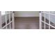 Inviting entryway with gleaming hardwood floors and a view into an adjacent room through glass french doors at 8692 Acadia Pkwy # 591, Sherrills Ford, NC 28673