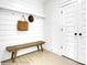 Entryway showcasing a wooden bench with hat and bag and access to white door closet space at 8692 Acadia Pkwy # 591, Sherrills Ford, NC 28673