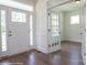 Welcoming foyer with white trim, a view of glass french doors, and beautiful hardwood flooring at 8692 Acadia Pkwy # 591, Sherrills Ford, NC 28673