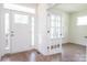 Welcoming foyer with white trim, a view of glass french doors, and beautiful hardwood flooring at 8692 Acadia Pkwy # 591, Sherrills Ford, NC 28673