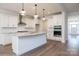 Modern kitchen features stainless steel appliances, a large island, and elegant pendant lighting at 8692 Acadia Pkwy # 591, Sherrills Ford, NC 28673