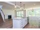 Open-concept kitchen boasts an island, stainless steel appliances, granite counters and hardwood floors at 8692 Acadia Pkwy # 591, Sherrills Ford, NC 28673