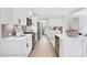 Modern kitchen showcasing white cabinets, stainless steel appliances, and a spacious island for food preparation at 8692 Acadia Pkwy # 591, Sherrills Ford, NC 28673