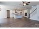 Open layout of kitchen features a large island, stainless steel appliances, and hardwood flooring at 8692 Acadia Pkwy # 591, Sherrills Ford, NC 28673