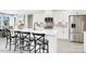 Bright kitchen features white cabinets, stainless steel appliances, an island with seating, and neutral backsplash at 8692 Acadia Pkwy # 591, Sherrills Ford, NC 28673