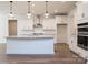 New kitchen boasts granite counters, stainless steel hood, pendant lighting, and hardwood floors at 8692 Acadia Pkwy # 591, Sherrills Ford, NC 28673