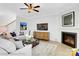 Comfortable living room featuring fireplace, stairs, neutral furniture, and a stylish coffee table at 8692 Acadia Pkwy # 591, Sherrills Ford, NC 28673
