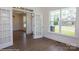 Bright room featuring hardwood floors, trim, a view to a room through glass french doors at 8692 Acadia Pkwy # 591, Sherrills Ford, NC 28673