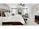 Luxurious main bedroom with a tray ceiling, white bedding, and a sitting area at 8692 Acadia Pkwy # 591, Sherrills Ford, NC 28673