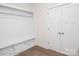 Mudroom with built-in shelving and hooks, paired with a closet for organized storage at 8692 Acadia Pkwy # 591, Sherrills Ford, NC 28673