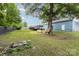 Spacious backyard showcasing a wood deck, lush lawn, and a serene outdoor ambiance at 875 Marys Grove Rd, Cherryville, NC 28021