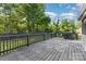 Spacious wooden deck with railing and grill setup, perfect for outdoor dining and entertaining at 875 Marys Grove Rd, Cherryville, NC 28021