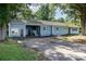 Exterior view featuring the home's driveway, covered carport, and manicured lawn at 875 Marys Grove Rd, Cherryville, NC 28021