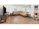 Bright living room with a large, comfortable sectional sofa and new, light-colored laminate flooring at 875 Marys Grove Rd, Cherryville, NC 28021