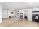 Open layout combines a dining area with a kitchen featuring white cabinets and black appliances at 875 Marys Grove Rd, Cherryville, NC 28021