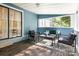 Charming sunroom with comfortable seating and views of the outdoor landscaping and natural light at 875 Marys Grove Rd, Cherryville, NC 28021