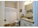 Cozy bathroom with granite counters, white cabinets and shower/tub combination at 8818 Artesa Mill Ln, Charlotte, NC 28214