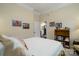 Comfortable bedroom featuring a queen-sized bed, bookshelf and neutral decor at 8818 Artesa Mill Ln, Charlotte, NC 28214