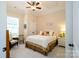 Sun-filled bedroom with white furniture, a ceiling fan and neutral decor at 8818 Artesa Mill Ln, Charlotte, NC 28214
