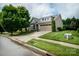 Charming two-story home with a well-manicured lawn and a two-car attached garage at 8818 Artesa Mill Ln, Charlotte, NC 28214