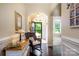 Entrance foyer with hardwood floors, neutral walls, and a view into other rooms of the home at 8818 Artesa Mill Ln, Charlotte, NC 28214