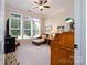 Cozy home office bathed in natural light featuring large windows, neutral decor, and comfortable seating at 8818 Artesa Mill Ln, Charlotte, NC 28214