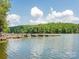 Beautiful view of the lake and dock with multiple piers at 8818 Artesa Mill Ln, Charlotte, NC 28214